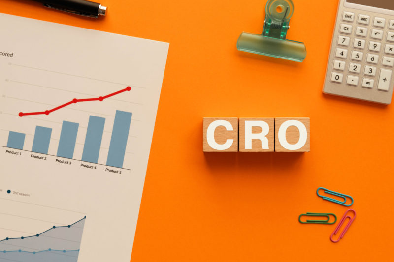Conversion Rate Optimization (CRO) concept with upward growth chart and business analytics showing small business website performance improvement.
